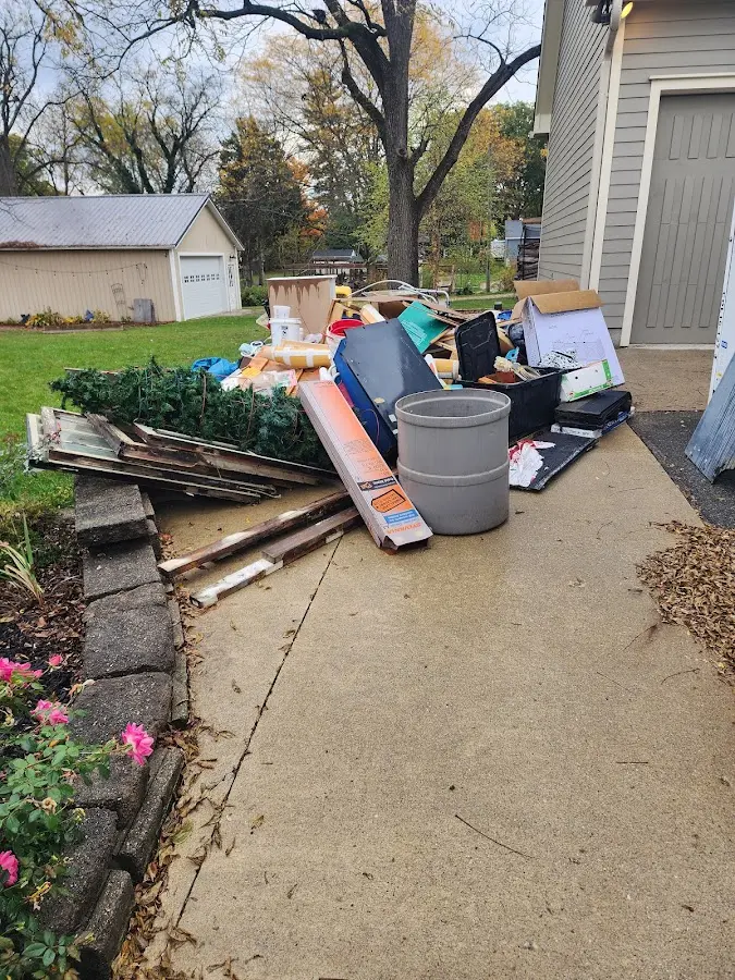 Dumpster being loaded with debris for Residential Dumpster Rental in Aquia Harbour